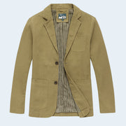 Khaki blazer with striped shirt on a light beige background