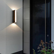 Matte Black Metal Wall Sconce with Vertical Design – Ideal for Outdoor Faucet Area by Walnut